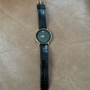 Movado Black and Gold Timepiece